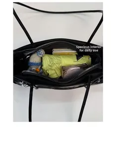 Detailed interior view showing large storage capacity for daily essentials in the tote bag