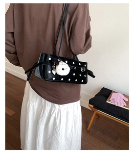 French vintage black polka dot shoulder bag with cute plush donut dog charm