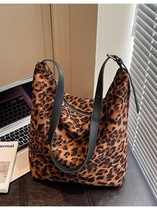 Large leopard print hobo tote bag with black adjustable leather strap and top zipper