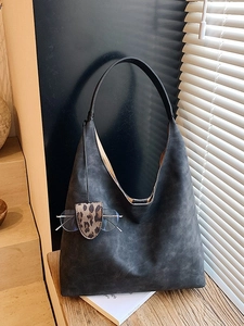 Chic dark grey suede tote bag with slim black straps and leopard print eyewear pouch