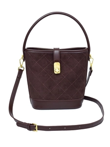 Deep brown suede and leather bucket bag with quilted patterns and gold hardware