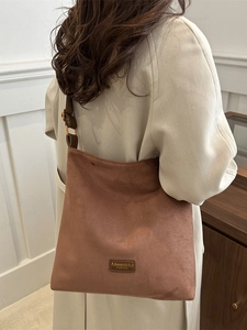 Vintage brown frosted faux-suede tote bag with adjustable straps and front leather label