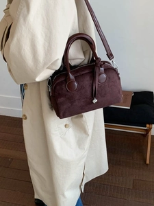 Deep brown faux suede Boston handbag with heart charm and adjustable shoulder strap