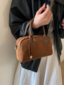 Brown faux suede Boston handbag with silver heart pendant and smooth leather handles