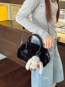 Fuzzy black faux fur mini Boston bag with plush bunny charm and adjustable strap