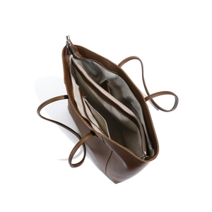 Detailed interior view of a brown leather tote bag with multiple compartments and zippers