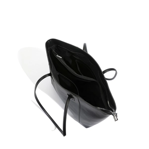 Internal view of large black tote bag showing compartments and silver zipper detail
