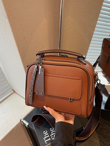 Vintage brown lychee grain leather crossbody bag with wide strap and twin zippers