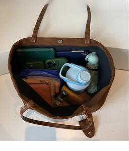Detailed view showing the large interior capacity of this brown suede tote bag