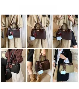 Detail shots of canvas and leather vintage tote bag with metal twist lock and charms