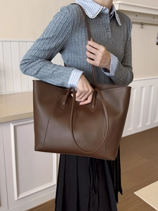 Minimalist large brown leather tote bag for women, perfect for daily commuting and leisure