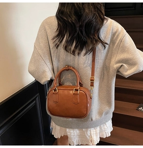 Caramel brown vintage crossbody bag shown on model for size and proportion reference