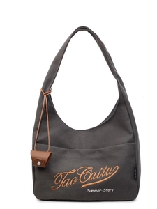 Charcoal grey canvas hobo bag with yellow embroidery and brown leather pendant charm