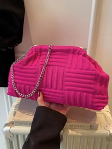 Pink woven shell clutch bag with silver chain strap and stylish textured knit design
