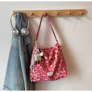Pink and dark red leopard print canvas tote bag with a cute plush toast pendant detail
