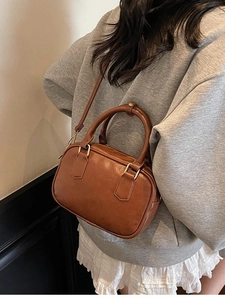 Brown vintage small Boston handbag with dual handles and crossbody strap for women