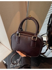 Vintage dark brown Boston style handbag with gold hardware and adjustable strap for women