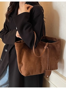Brown faux suede tote bag shown on a model with minimalist style for autumn and winter outfits