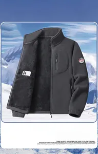 Detail of dark grey fleece jacket featuring chest zip pocket and warm inner lining