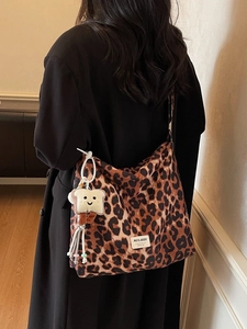 Leopard print hobo shoulder bag for women with a cute cartoon toast plush pendant