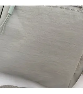 Detailed close-up of high-density nylon fabric with smooth stitching and top zipper closure