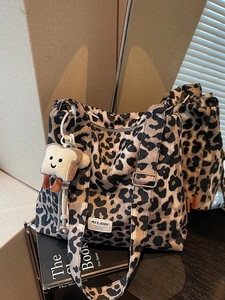Leopard print canvas tote bag for women featuring a cute toast plush pendant accessory