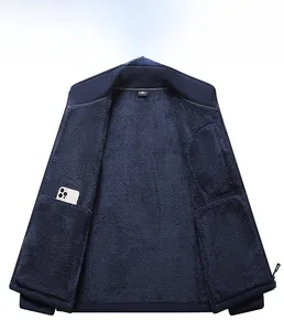 Detail view of the deep blue fleece jacket inner pocket with a smartphone inside