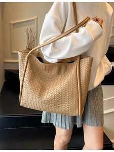 Large vintage woven khaki tote bag for women showing a stylish casual shoulder design