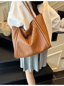 Brown woven leather tote bag with long straps for women's daily commute fashion