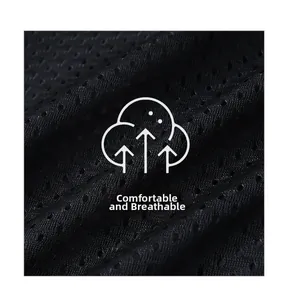 Close-up of black breathable mesh fabric showing honeycomb texture and ventilation holes