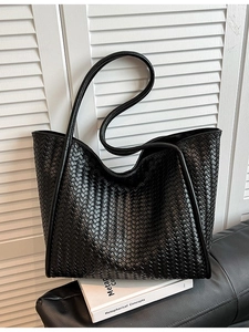 Large black woven faux leather tote bag with long shoulder straps for women