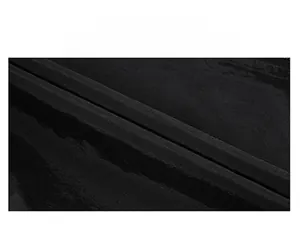 Detailed macro view of the durable waterproof black polyester fabric for fishing vest