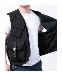 Detail of multi-pocket tactical vest showing the breathable black mesh lining and fabric