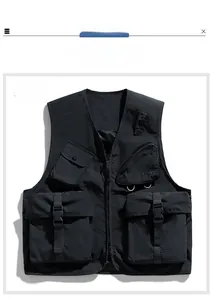 Detail of black utility tactical vest with multiple functional pockets and D-rings