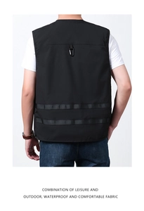 Detailed back view of a black outdoor vest featuring functional hanging loops and webbing straps