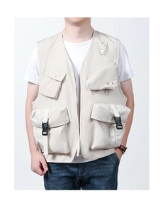 Detail of beige outdoor utility vest featuring multi-functional pockets and D-ring