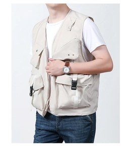 Detail view of multi-pocket fishing vest showing buckle closures and utility pockets