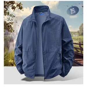Detail of dark blue lightweight sun protection jacket with zip pockets and stand collar