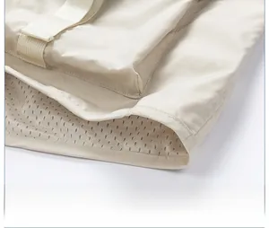 Detail showing high-quality hem with breathable mesh lining and fine stitching on vest