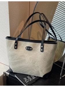 Vintage olive green large capacity tote bag with black leather trim and metal logo