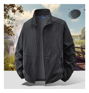 Detail of lightweight black zip-up sun protection jacket with outdoor scenery backdrop