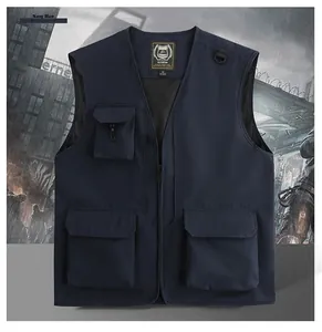 Detail of navy blue multi-pocket utility vest with mesh lining and metal D-ring attachment