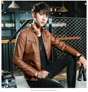 Detail of brown slim fit biker jacket featuring quilted shoulders and metallic zippers