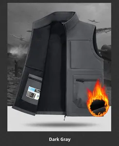 Detail of dark gray outdoor vest showing the durable fabric and warm black fleece lining