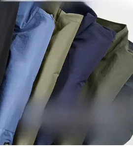 Detail of multi-color wrinkle-resistant outdoor jackets in navy, olive, and blue fabrics