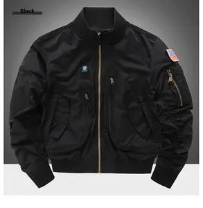 Detail of black military flight jacket with tactical patches and elastic ribbed cuffs