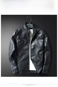 Close-up of black leather jacket featuring stand collar and functional zipper pockets