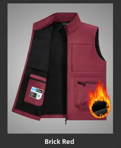 Detail of red outdoor softshell vest showing warm black fleece lining and zip pockets