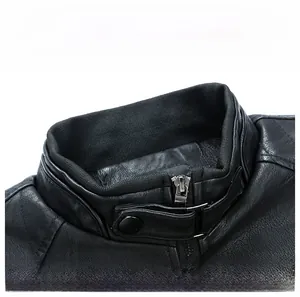Macro detail of men's leather jacket collar featuring strap buckle and grain texture