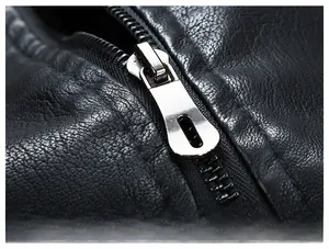 Macro view of high-quality black leather texture and polished silver metal zipper detail